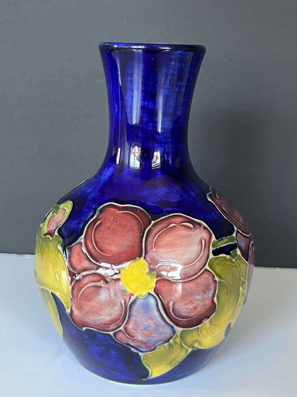 Glossy Cobalt Blue Ceramic Floral Vase with Pink Blooms